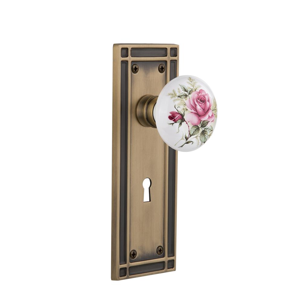 Nostalgic Warehouse MISROS Privacy Knob Mission Plate with White Rose Porcelain Knob and Keyhole in Antique Brass